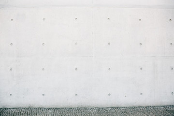 Empty concrete white or gray outer wall and sidewalk.