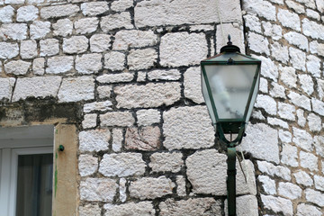 Wood and stone details on an old traditional mediterranean house. Selective focus. 
