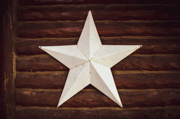 Metal White Star on Wooden Background