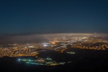 Foggy night mountaintop view of suburban Simi Valley near Los Angeles in Ventura County California.