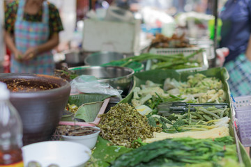 Vegetables and herbs  for sale from an outdoor street vendoor. © john