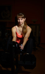 Naklejka na ściany i meble Fitness girl exercising in the gym. Sport, active lifestyle.