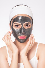 beautiful woman masking her face on white background