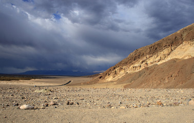 Road, desert, and mountains in Death Valley National Park, California