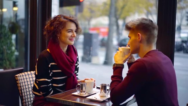 Beautiful couple having a nice date in a cafe together.