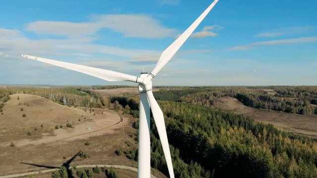 Modern wind towers producing energy. Aerial view from drone.