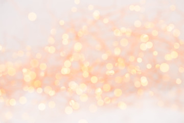 Obraz premium Christmas greeting card. Christmas tree branch on glitter golden bokeh lights background. New Year concept. Copy space.