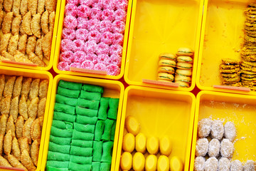 High angle view of unidentified man selling traditional Asian Asian confectionery, cakes and sweet in Kota Kinabalu Sabah Borneo Malaysia