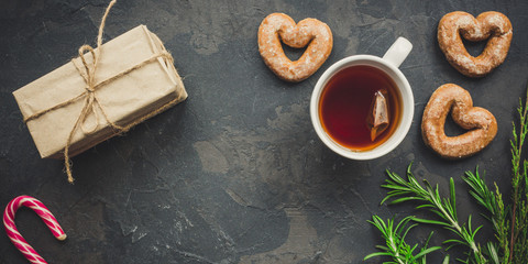 tea - a cup of tea and gifts for the holiday. Brewed tea bag, cup of tea and a festive atmosphere....