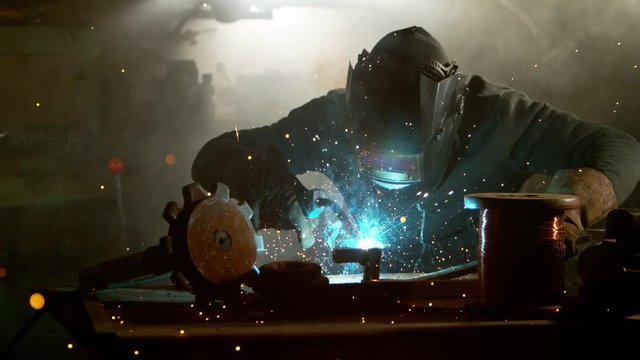 Super slow motion of working welder in workshop, filmed on high speed cinema camera, 1000 fps.