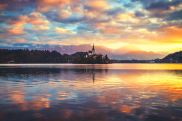 Lake Bled with St. Marys Church of the Assumption on the small island; Bled, Slovenia, Europe.