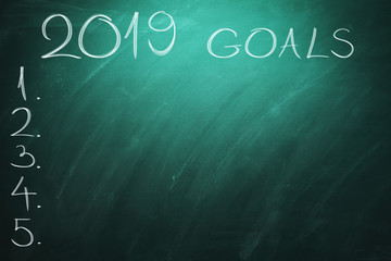2019 Goals on green board. Chalkboard. New year - new business challenges.