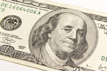 Front of the one hundred dollar bill with a Portrait of President Benjamin Franklin's close-up