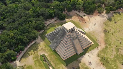 Aerial view of ancient Mayan city of Chichen Itza, famous mesoamerican pyramid El Castillo (Temple of Kukulkan) - landscape panorama of Yucatan Peninsula from above, Mexico, North America, 4k UHD