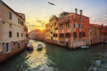 Beautiful narrow canal with silky water in Venice