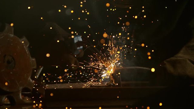 Super slow motion of working welder in workshop, filmed on high speed cinema camera, 1000 fps.