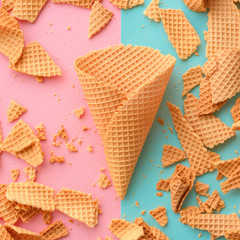 Ice cream waffle cones on pastel pink and blue background