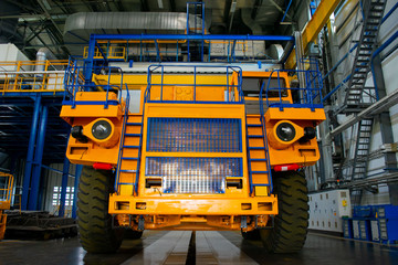 Big mining truck in the production shop of the car factory. Belaz is a Belarusian manufacturer of haulage and earthmoving equipment, dump trucks, haul trucks, heavy equipment. © MaxSafaniuk