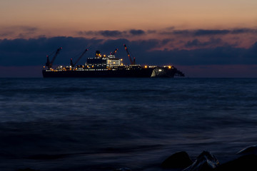 the ship puts a gas pipe in the night
