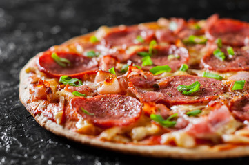 Pepperoni Pizza with Mozzarella cheese, salami, bacon, Tomato sauce, pepper, Spices and Fresh green...