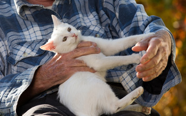 Elderly man with cat