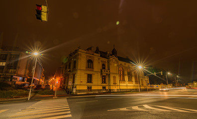 Klatovy new street with cars in autumn night with orange sky