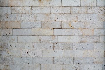 Wall made of bright stone blocks