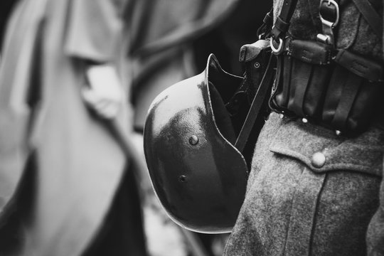 Helmet on the belt with the equipment of the Wehrmacht soldier