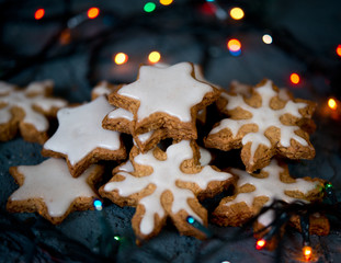 Christmas cookies snowflakes and stars on a black background