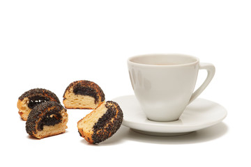 Cookie with poppy seeds and white cup of black coffee on white background, isolated