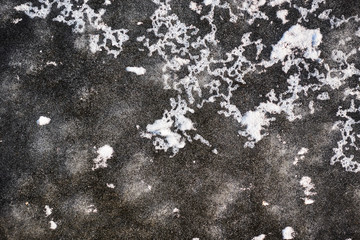 Ice with air bubbles and fresh snow