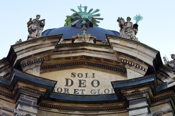 Fototapeta premium An ancient stone baroque cathedral with a copper dome and stucco molding. Facade of Dominican Cathedral in Lviv City, Ukraine