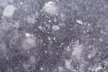 Ice with air bubbles and fresh snow