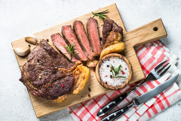 Grilled beef steak ribeye on white. 