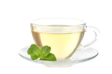 Cup of tea with mint leafs isolated on white background