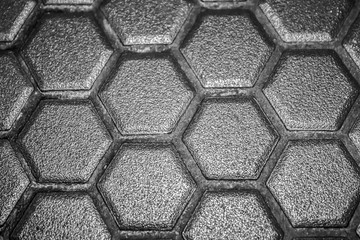 Ceramic tiles mosaic made of gray rhombuses, without grouting, the mesh-base and glue is visible. The concept of repair. Background. Top View
