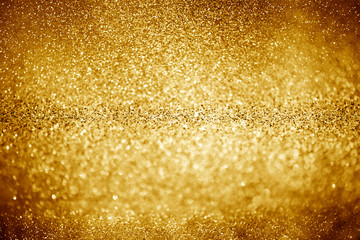 gold glittering Christmas lights. Blurred abstract background