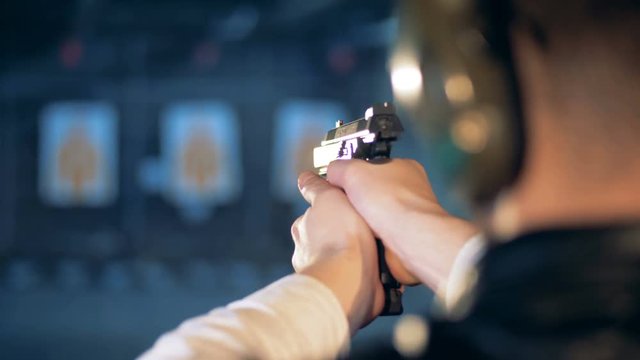 Gunshot of a man aimed intro targetboards