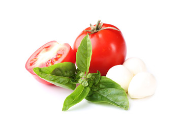 Mozzarella, tomatoes and basil leafs isolated on white background