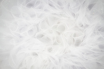 Pure white tulle fabric in an intricate frill that can be used as the background for bridal showers...