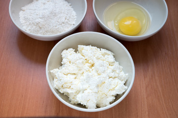 ingredients for cheesecakes, flour, cottage cheese eggs. Horizontal photo format