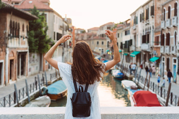 young girl walks the streets of Venice