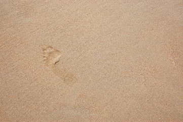 Man trail on flat sand
