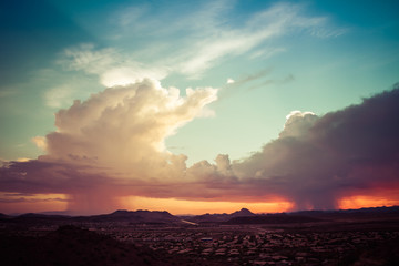A monsoon storm over the desert of Arizona during sunset.