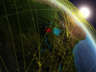Rwanda from space on realistic model of planet Earth with network. Concept of digital technology, connectivity and travel.