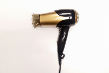 Black and gold hair dryer isolated white background.