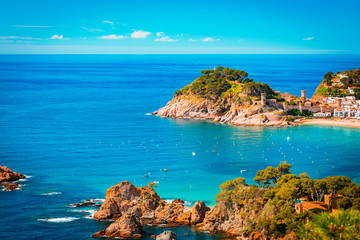 Spanish mediterranean coast at the Costa Brava with village Tossa de Mar and his medieval. Teal and...