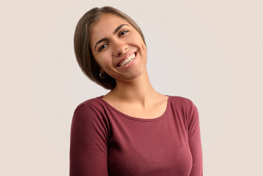 The concept of positive emotions. A cheerful student has fun during a break in College, laughs at the jokes of classmates, Isolated on background