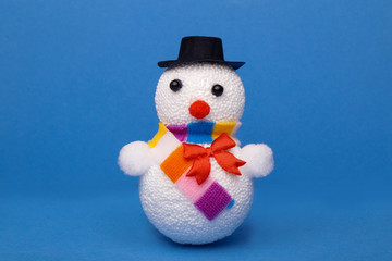 Christmas, New Year's snowman on a blue background. Christmas background