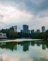 Buildings reflected on water at the sunset